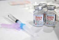 vaccine bottles and needle