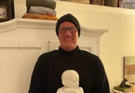 Michael Sykes with his sculpture of a baby