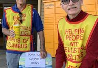 two volunteers collecting donations
