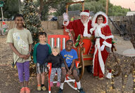 Santa and Mrs. Claus with neighborhood children